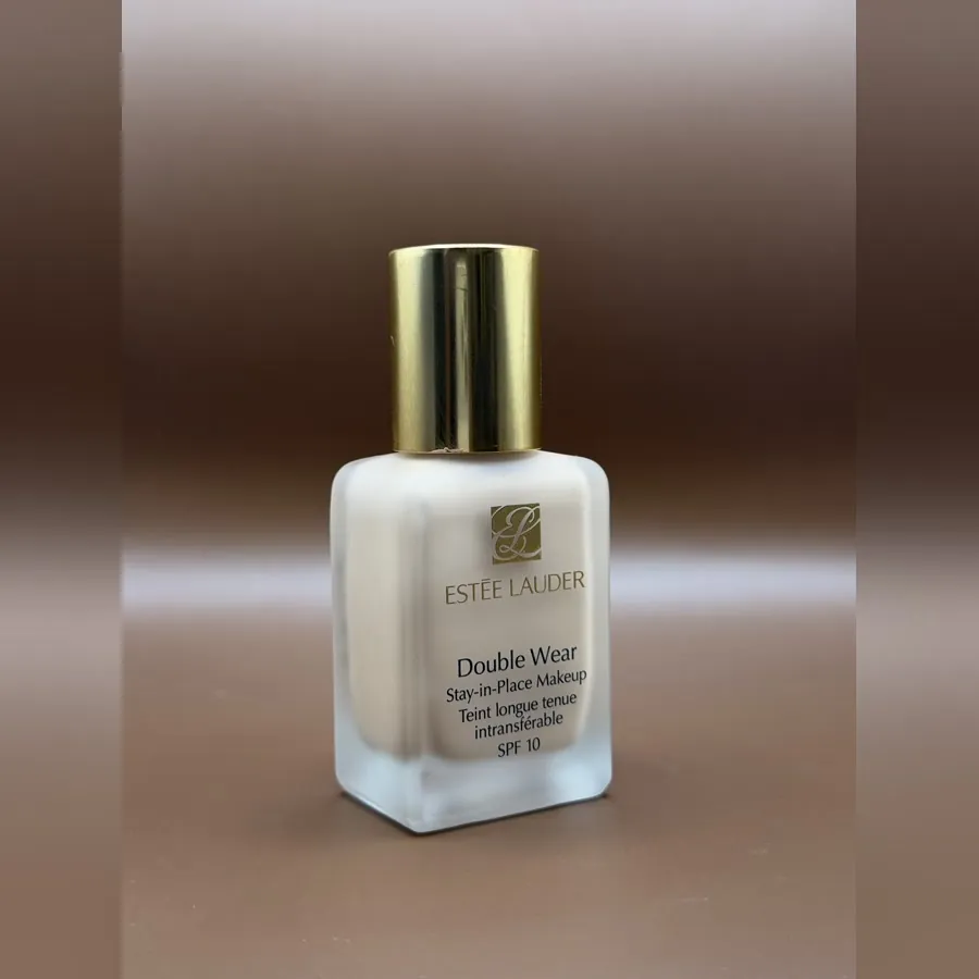 Estee Lauder Double Wear foundation in the frosted glass bottle with a gold lid