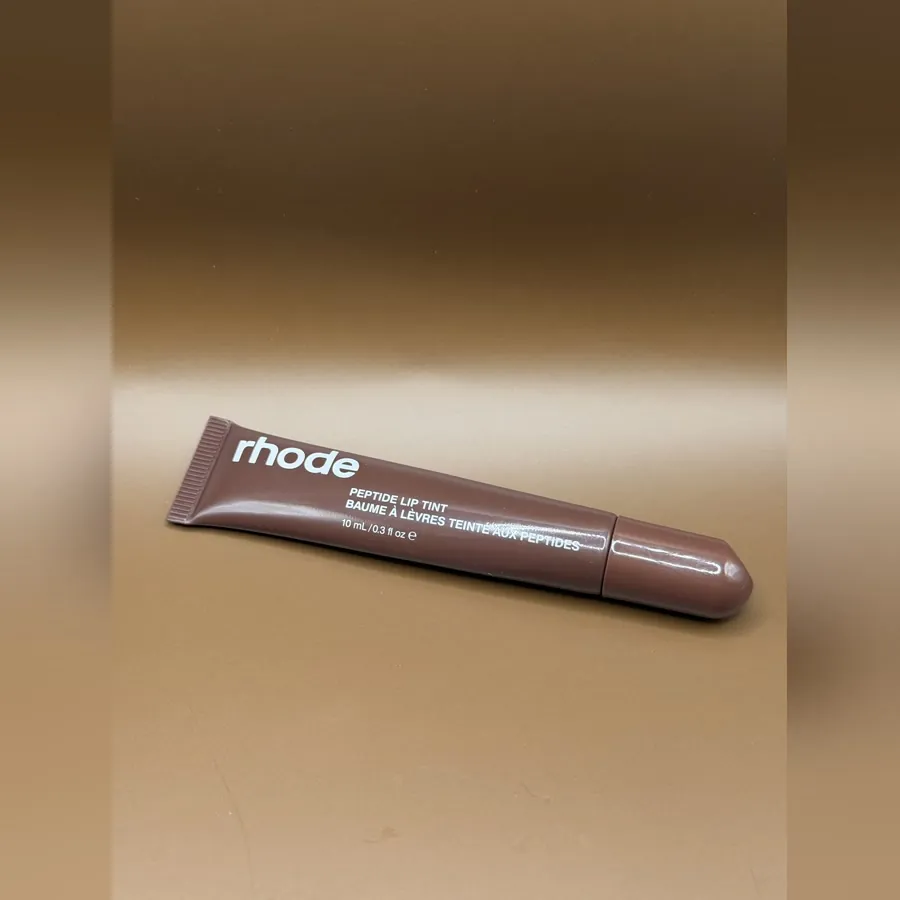 rhode Peptide Lip Tint in a soft brown squeeze tube